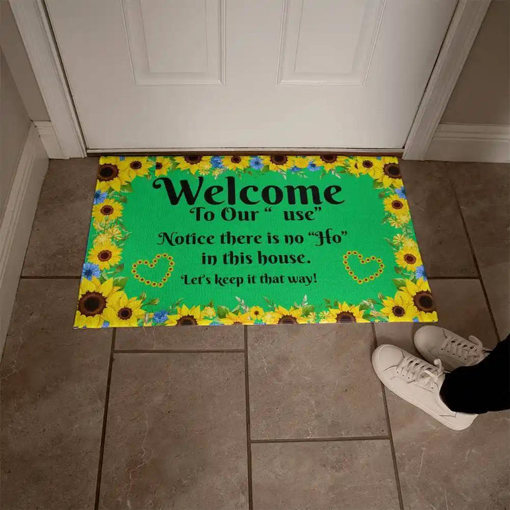 welcome mat in front of white door