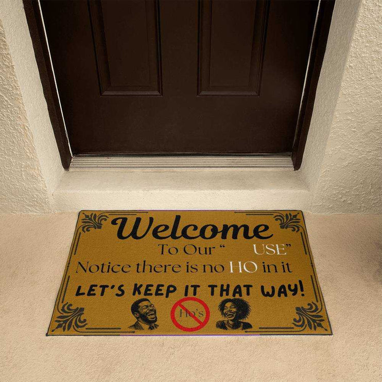 welcome mat in front of brown door