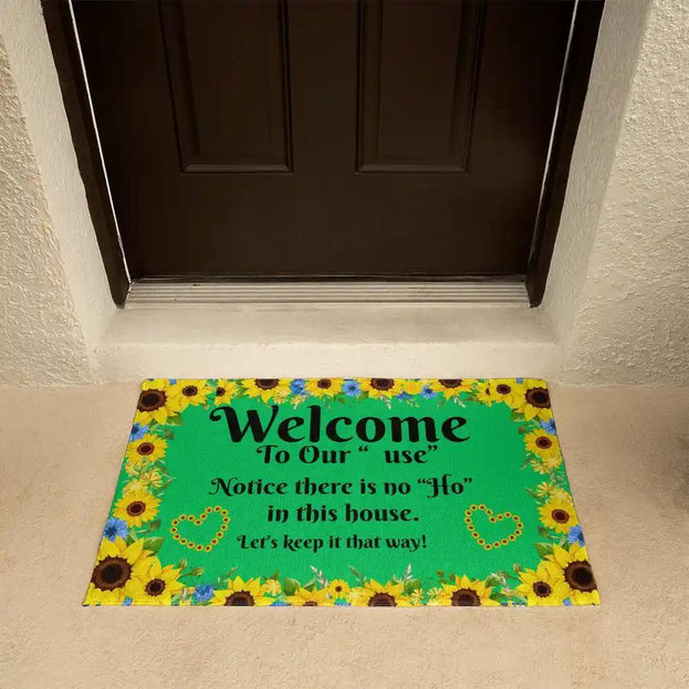 welcome mat in front of brown door