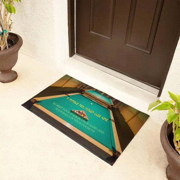 a welcome mat by a brown front door with a side angle