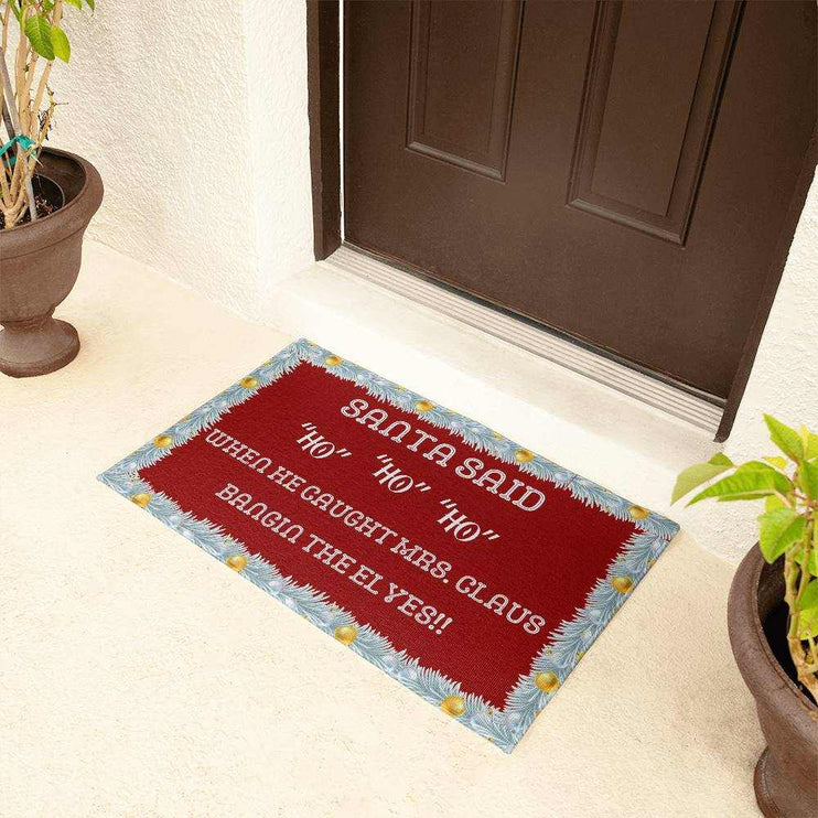 welcome mat by a brown front door with plants