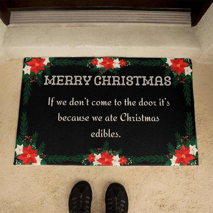 welcome mat by brown door with persons feet