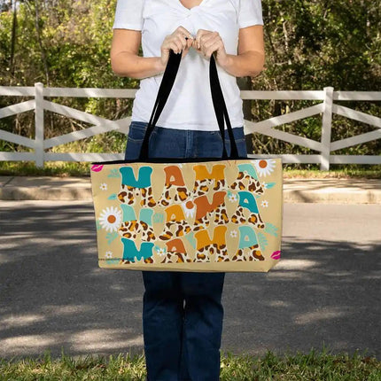 a large tote bag with mama design in models hands