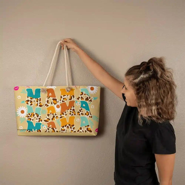 a large tote bag with mama design on the wall