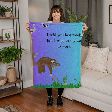 a coral fleece blanket with theme "The lazy Sloth" with model
