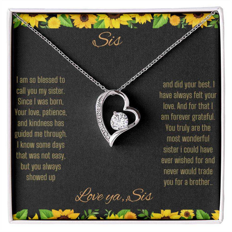 Forever Love Necklace with a white gold charm on a To Sis from Sis greeting card up close