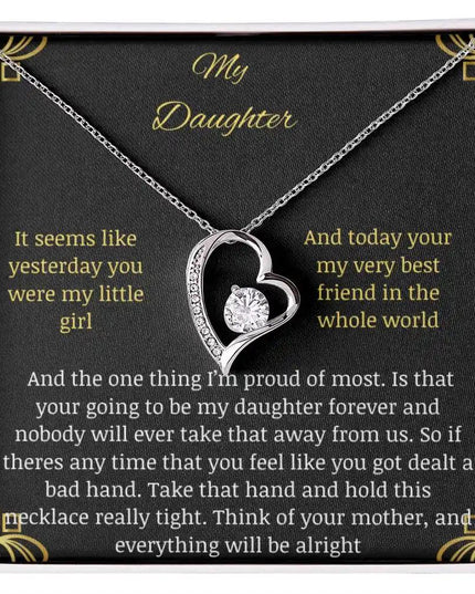 Forever Love Necklace with a white gold pendant in a two-toned box with a greeting card to daughter from mother close up looking down