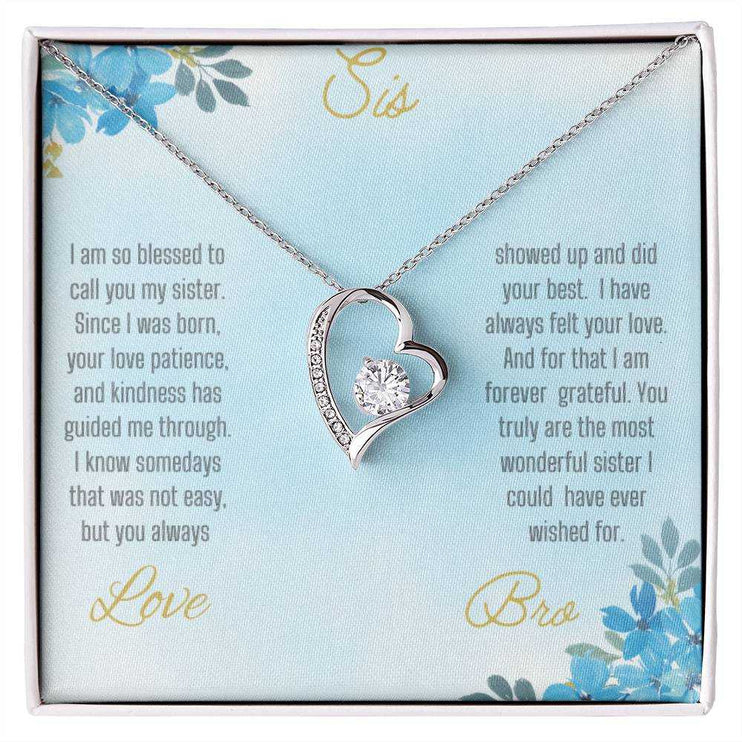 Forever Love Necklace with a white gold variant on a to sis from bro greeting card close up view.