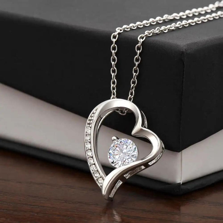 white gold forever love necklace on a two-tone box