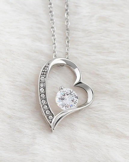 white gold forever love necklace on white fleece