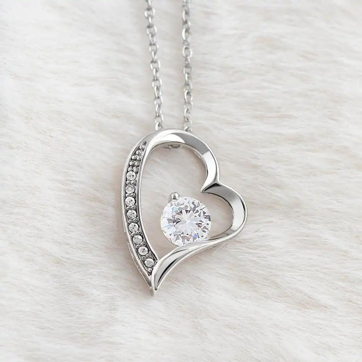 white gold forever love necklace on white fleece