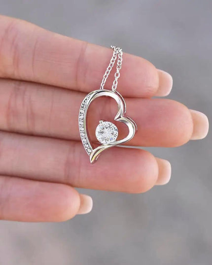 white gold forever love necklace in model's hand