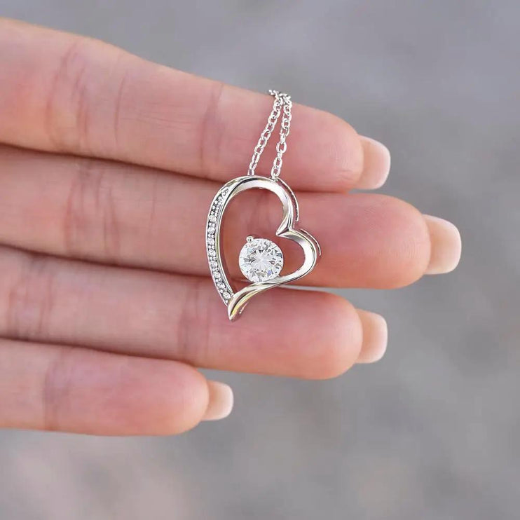 Forever Love Necklace white gold in a models hand