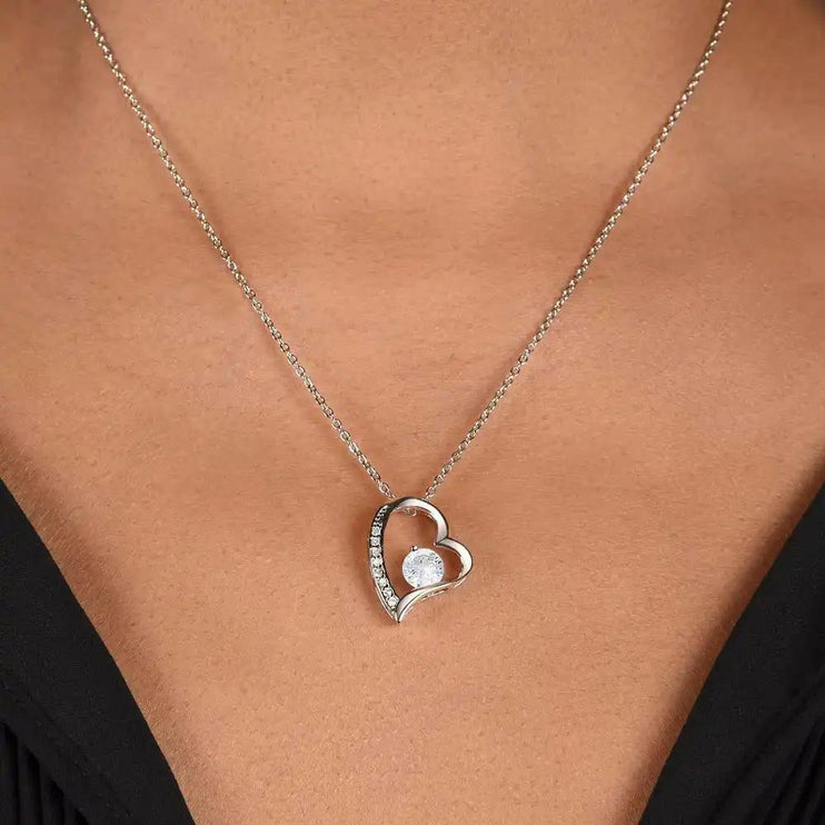 white gold forever love necklace on model's neck