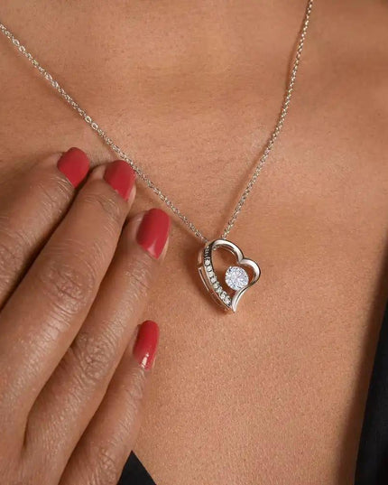 white gold forever love necklace on model's neck