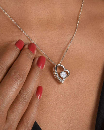 white gold forever love necklace on a model's neck