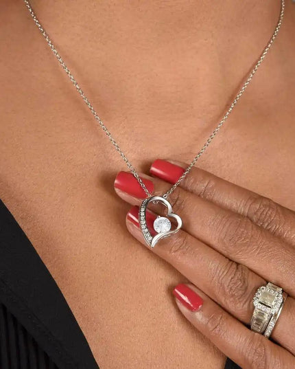 white gold forever love necklace on a model's neck