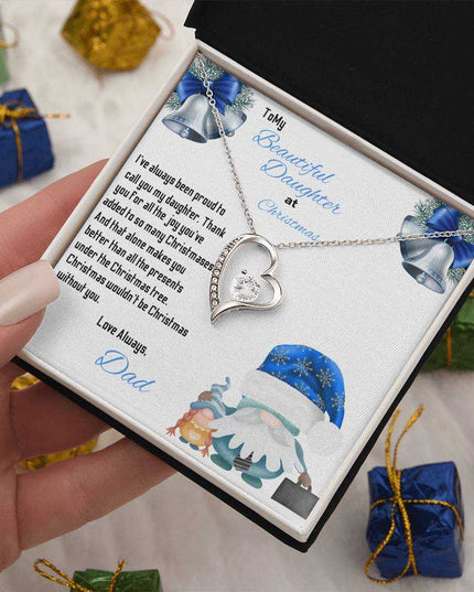 white gold forever love necklace in a soft box in a model's hand