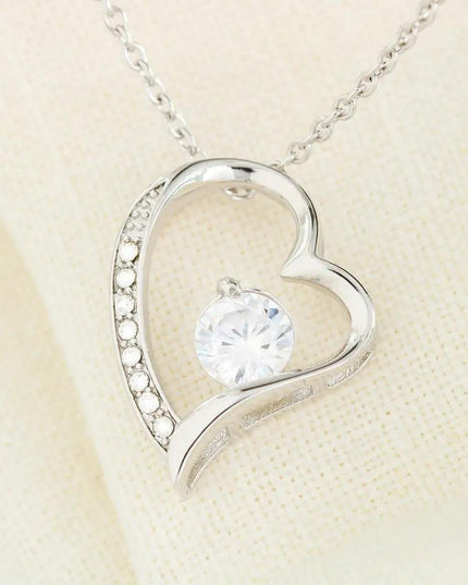 white gold forever love necklace on a white cloth