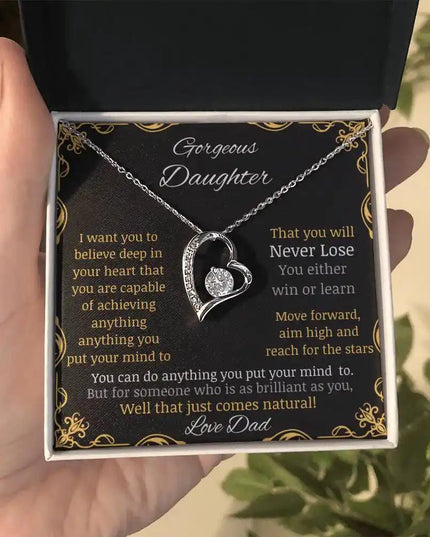 Forever Love Necklace with a white gold pendant in a two-tone box with a to daughter from dad greeting card further away in a hand