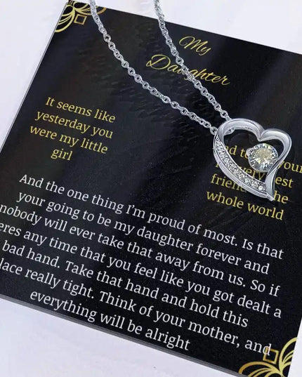Forever Love Necklace with a white gold charm in a two-toned box with necklace shifted to right side and box angled to the left