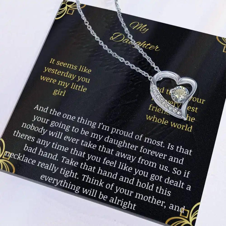 Forever Love Necklace with a white gold charm in a two-toned box with necklace shifted to right side and box angled to the left