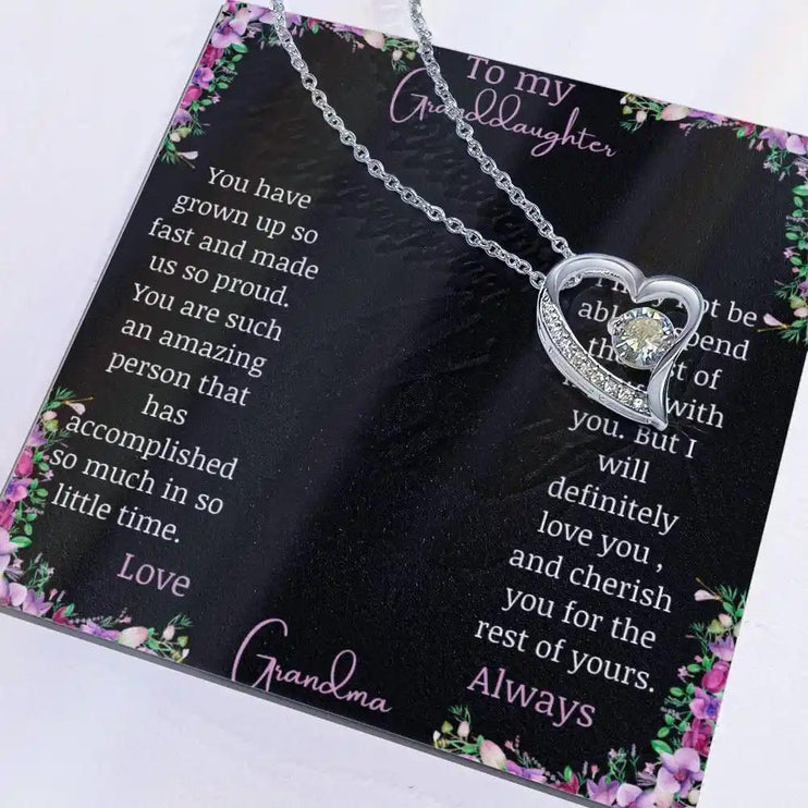 Forever Love Necklace with a white gold charm on a for granddaughter from grandpa greeting card with necklace slid to the right side of greeting card