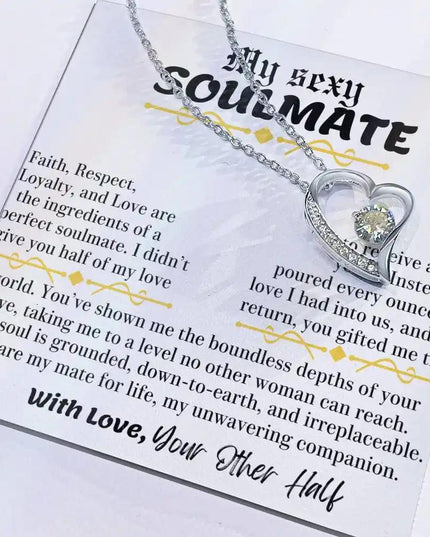 a white gold forever love necklace up close with pendant slid to side