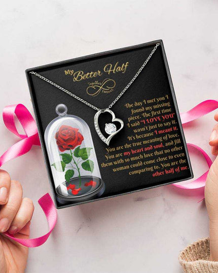 white gold forever love necklace in a soft box wrapped with pink bow