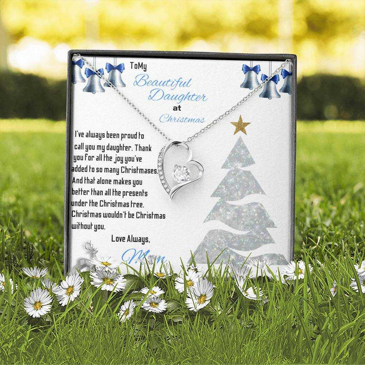 white gold forever love necklace in soft box in the grass