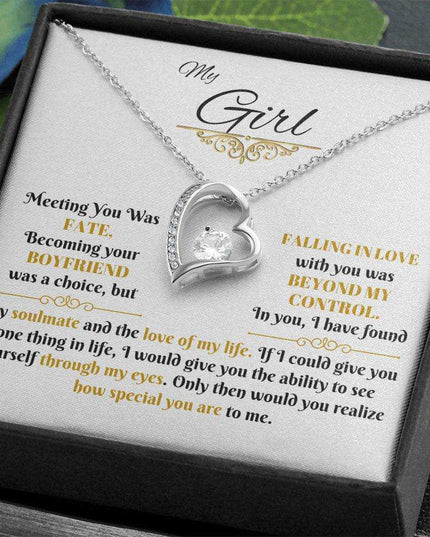 white gold forever love necklace in a soft box angled to the left