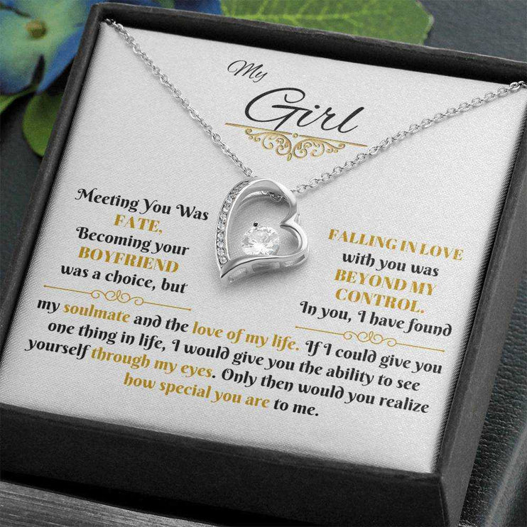 white gold forever love necklace in a soft box angled to the left