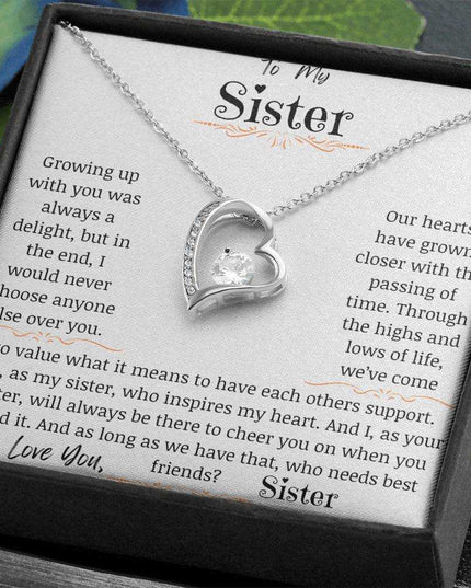 a white gold forever love necklace up close angled right