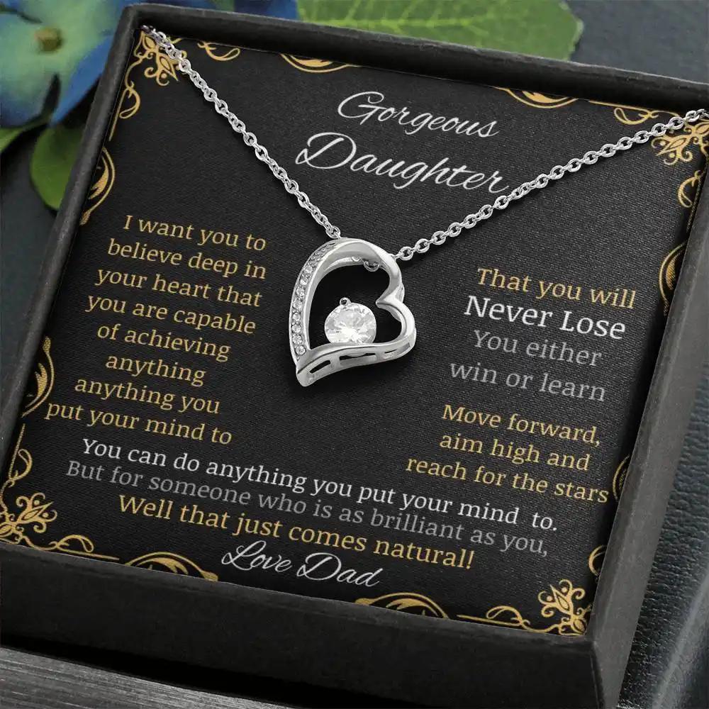 Forever Love Necklace with a white gold pendant in a two-tone box with a to daughter from dad greeting card angle close up