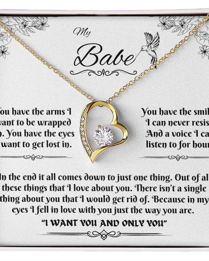 yellow gold forever love necklace in a soft box up close