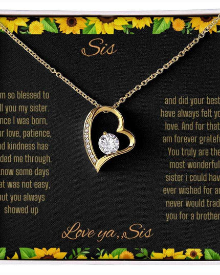 Forever Love Necklace with a yellow gold charm on a To Sis from Sis greeting card up close