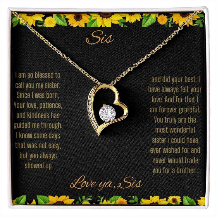 Forever Love Necklace with a yellow gold charm on a To Sis from Sis greeting card up close