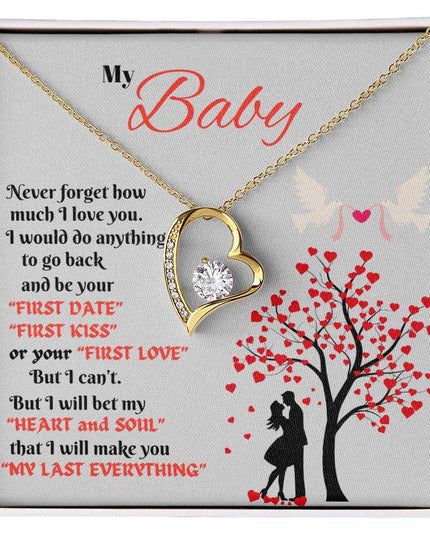 yellow gold forever love necklace in a soft box up close