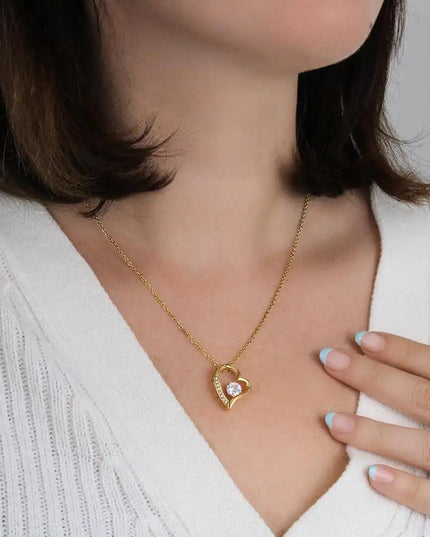 yellow gold forever love necklace on models' neck