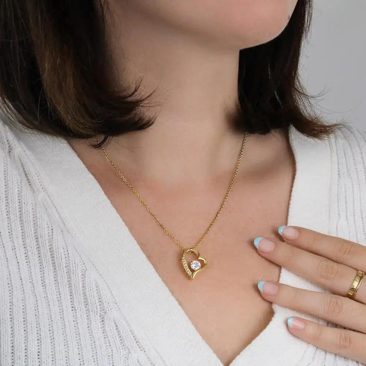 yellow gold forever love necklace on models' neck