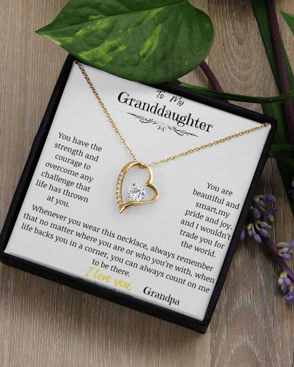 a yellow gold forever love necklace up close in a two-tone box