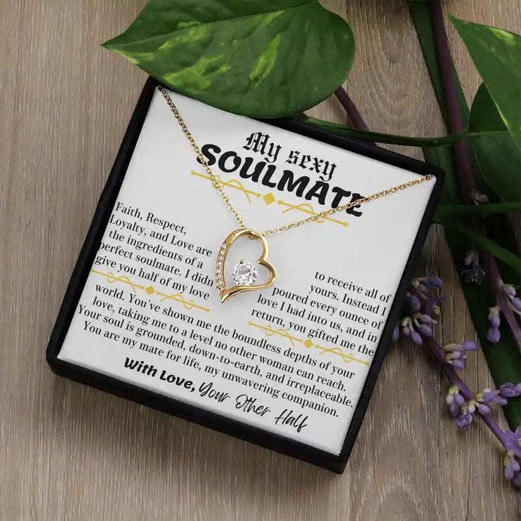 a yellow gold forever love necklace in a two-tone box