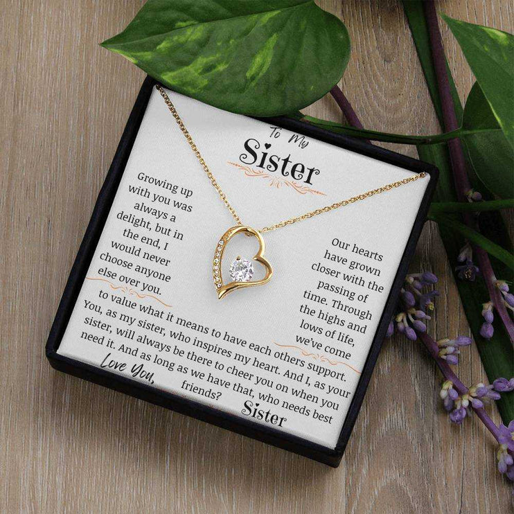 a yellow gold forever love necklace angled right on table