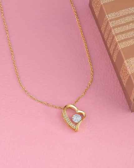 yellow gold forever love necklace on pink table