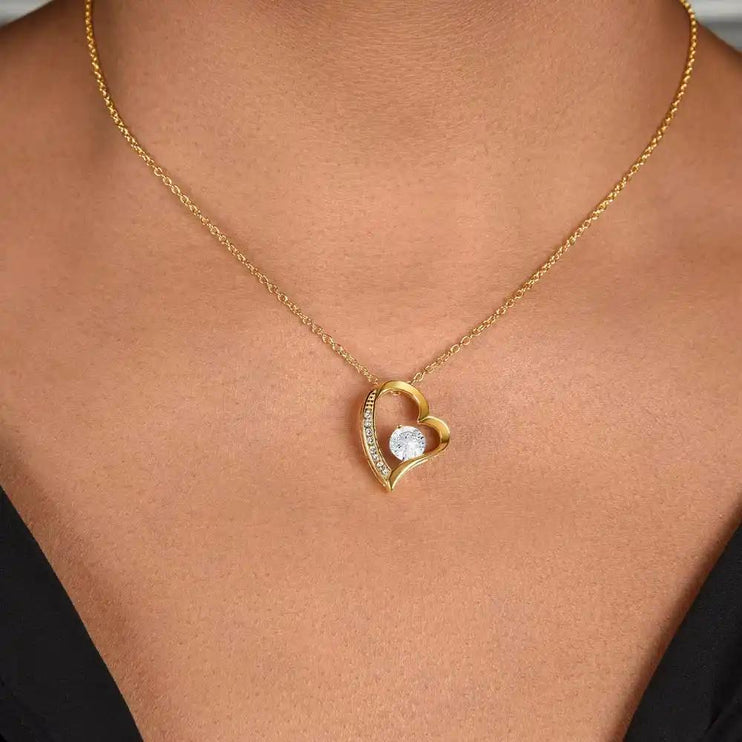 yellow gold forever love necklace on model's neck