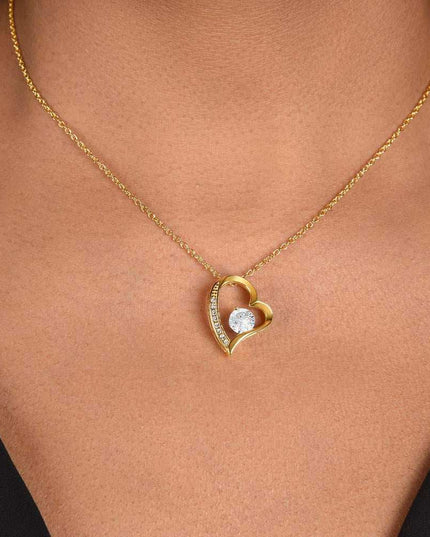 yellow gold forever love necklace on a model's neck