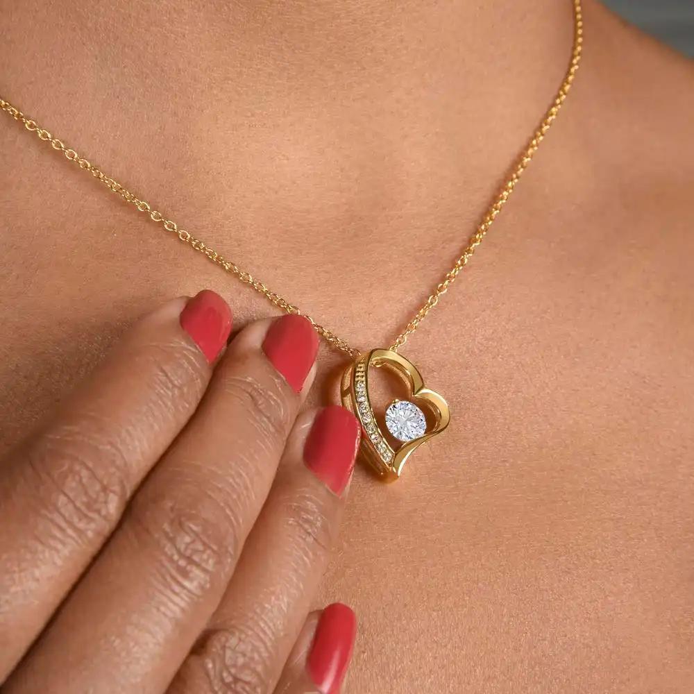 yellow gold forever love necklace  on model's neck