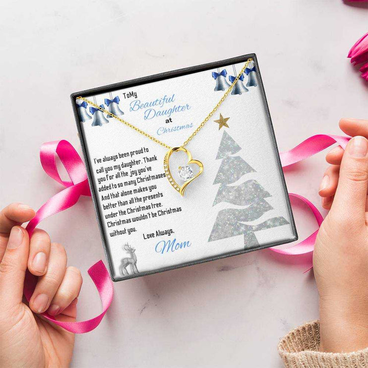 yellow gold forever love necklace in a soft box being gift wrapped