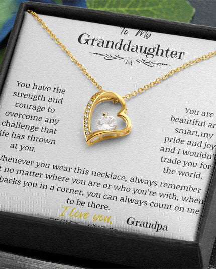 a yellow gold forever love necklace up close in a two-tone box up close