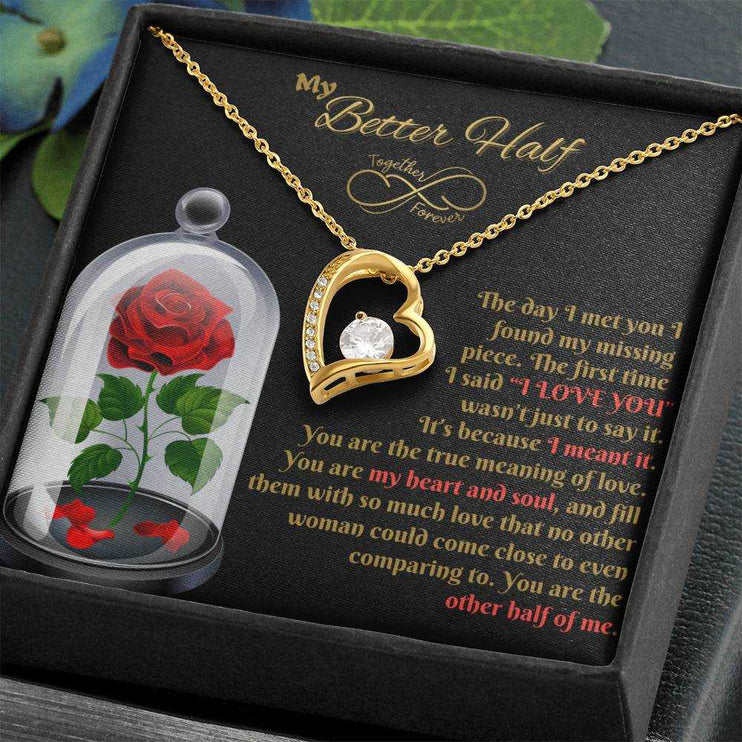 yellow gold forever love necklace in a soft box angled right